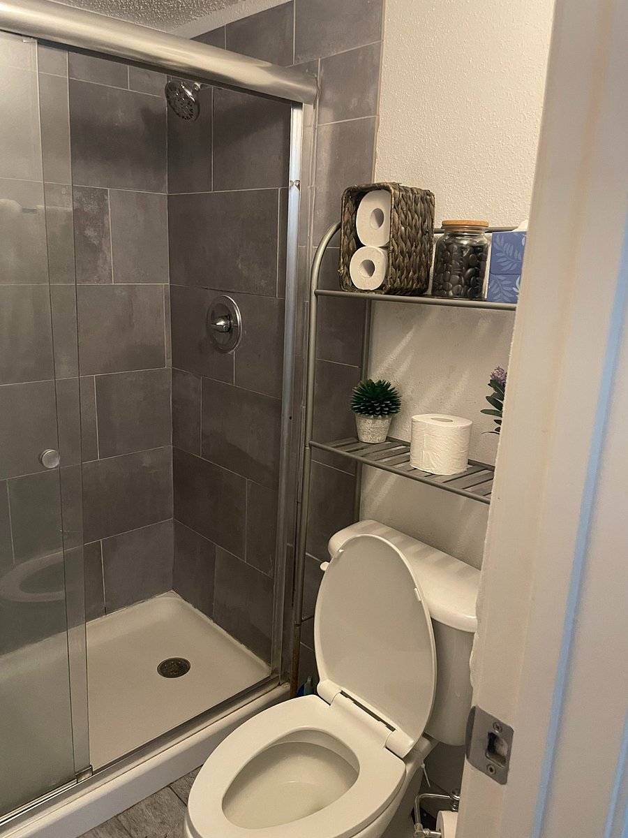 Tiled shower with glass enclosure