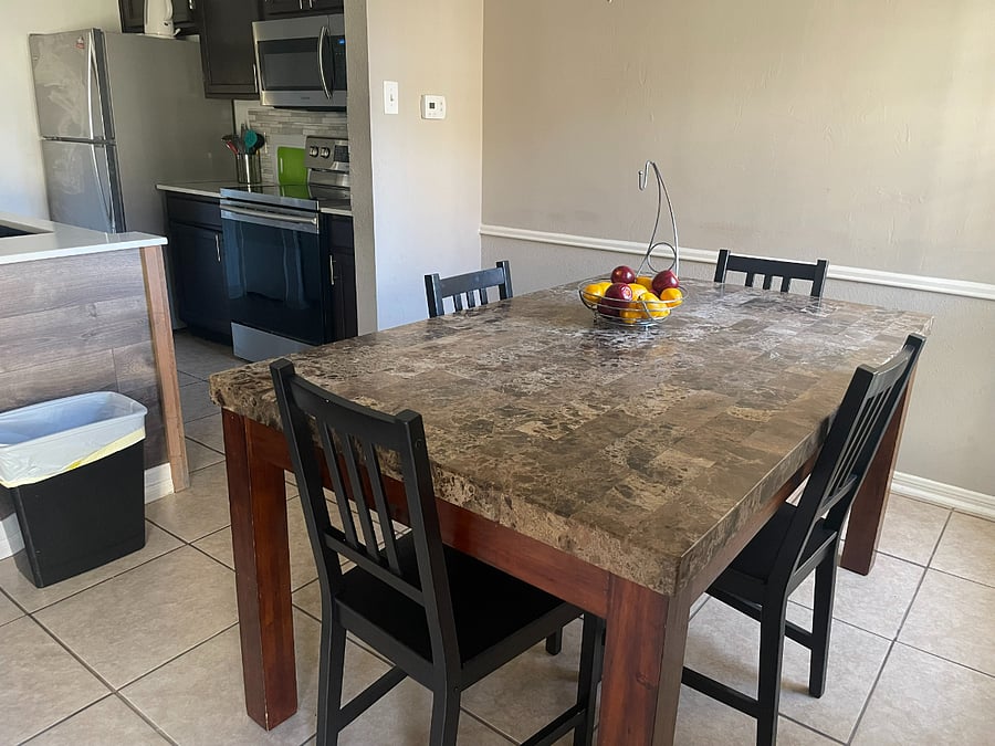 Nice dining table for meals or to gather around.