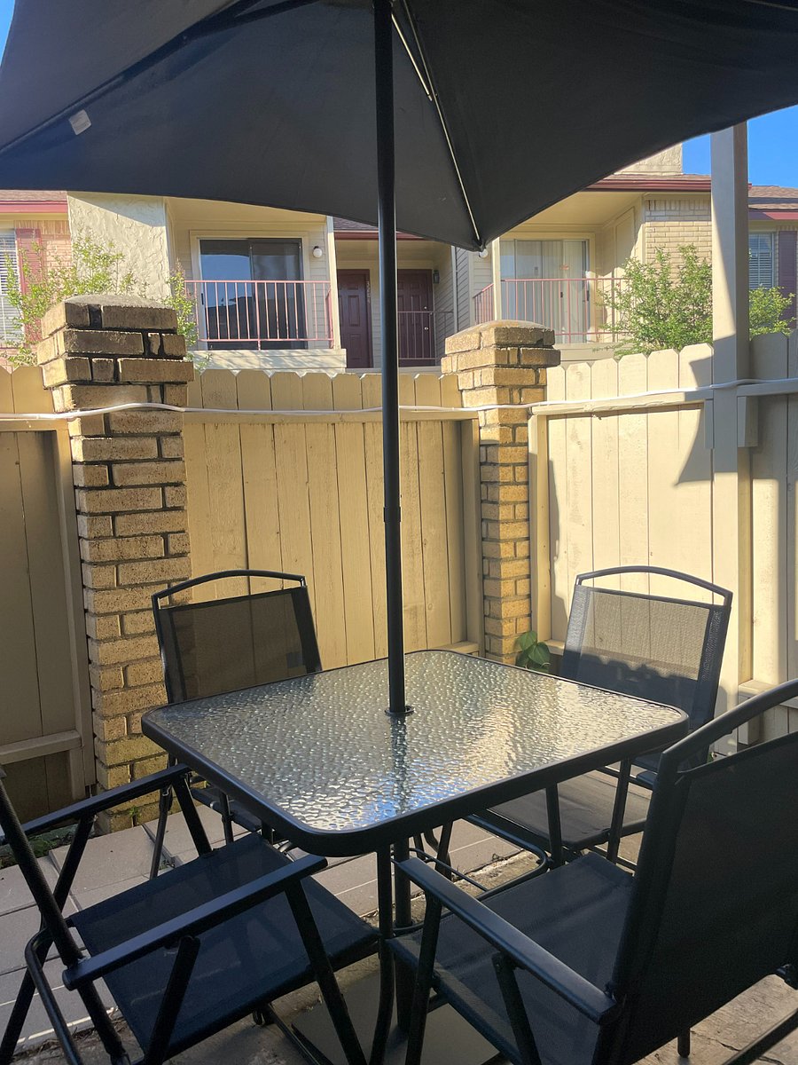 Cozy outside patio with furniture and lighting serves as a comfortable retreat