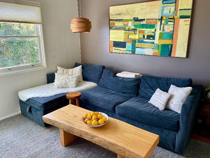 West Elm velvet sofa converts into a queen bed.