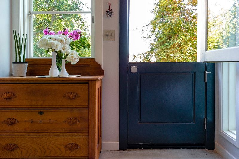 With separate entrance, locking door, kitchenette, and half-bath, the bottom floor can live as a studio-like apartment space.