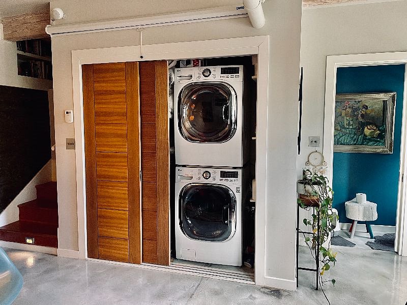 Washer and Dryer. A screen can be pulled down from above the closet doors for projecting TV and movies.