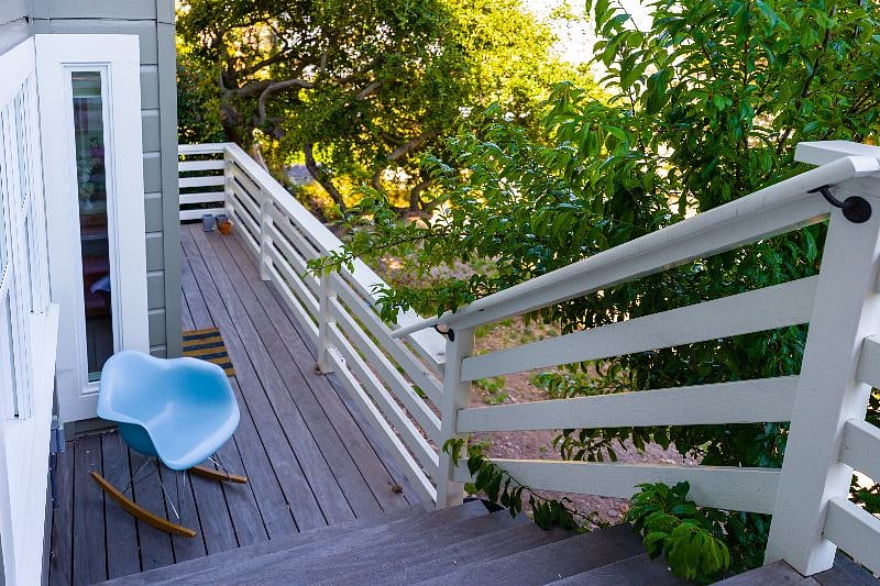 Exit the bottom floor to a small private deck which opens to the shared back yard space