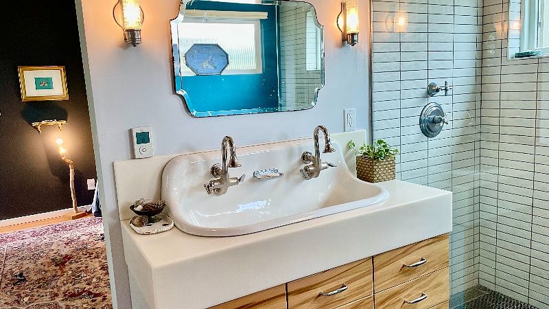 The master bath features a tub, open shower, toilet room, double sink, and vanity area.