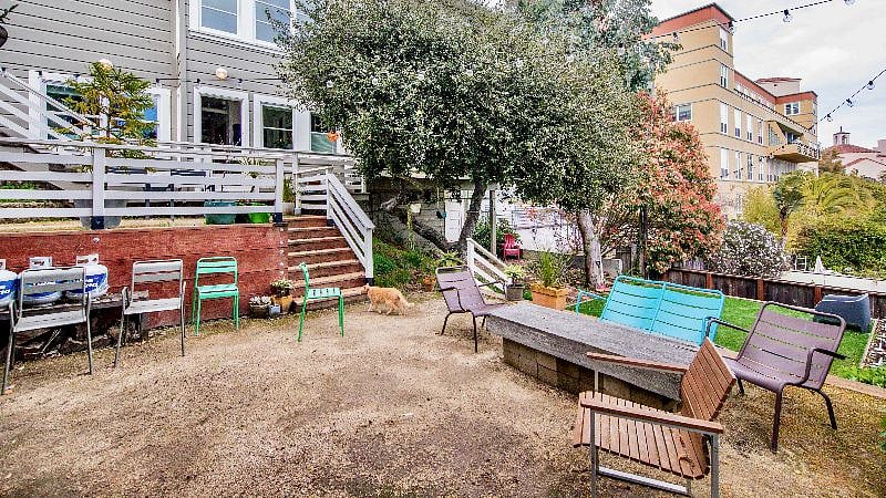 Community space in the back yard features sitting area, BBQ, heat lamps, gardening boxes with drip irrigation, turf lawn, and children's climbing rope jungle gym