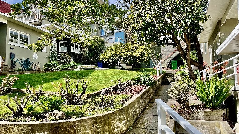 View from cottage porch of courtyard. Courtyard is secured by a gate with digital code.