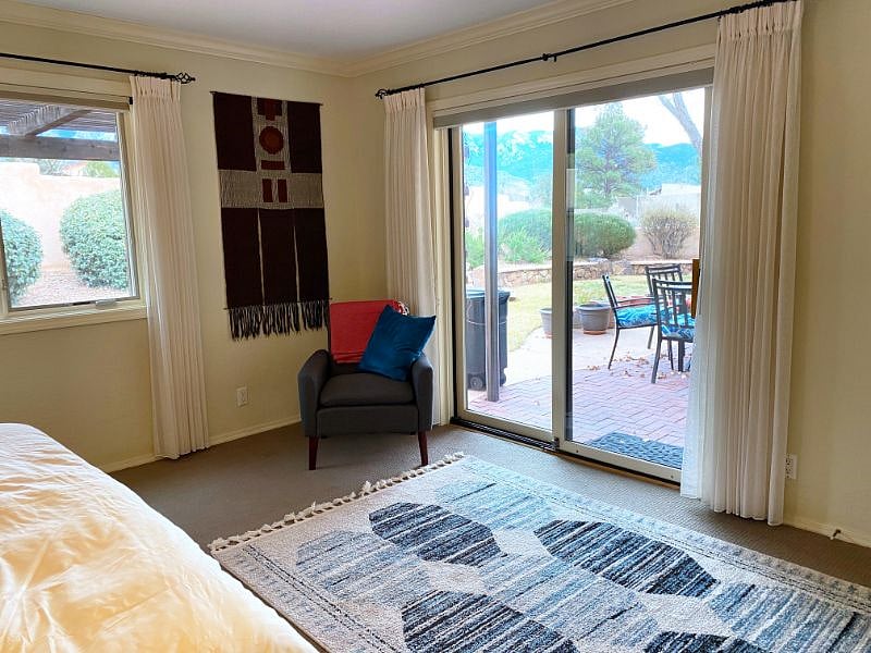 Master bedroom with sliding glass door to backyard patio