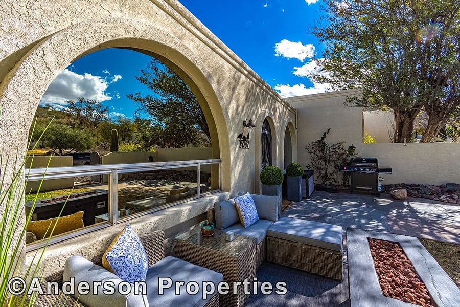 Plush outdoor seating, fireplace and gas grill