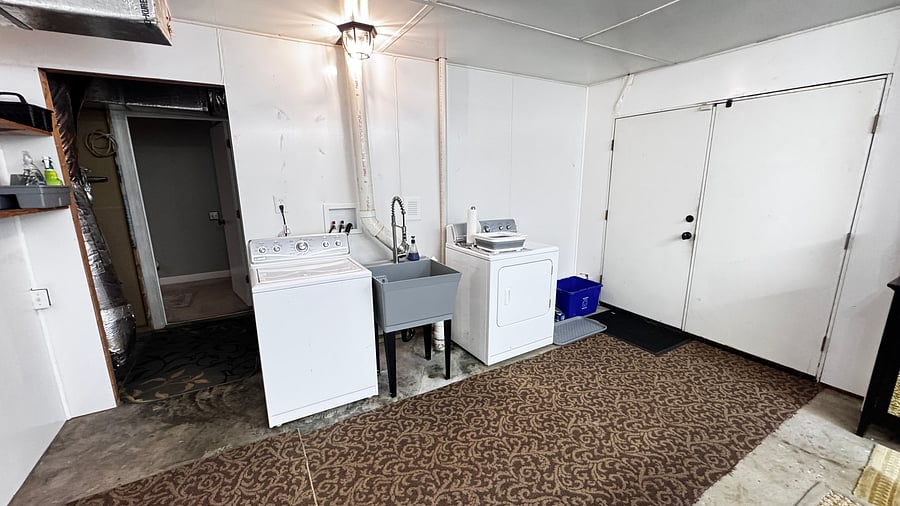 Washer and dryer and entrance into kitchen.