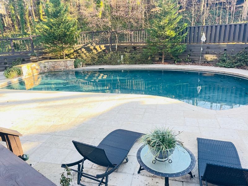 5 Ft depth swimming pool with fountains, not heated.