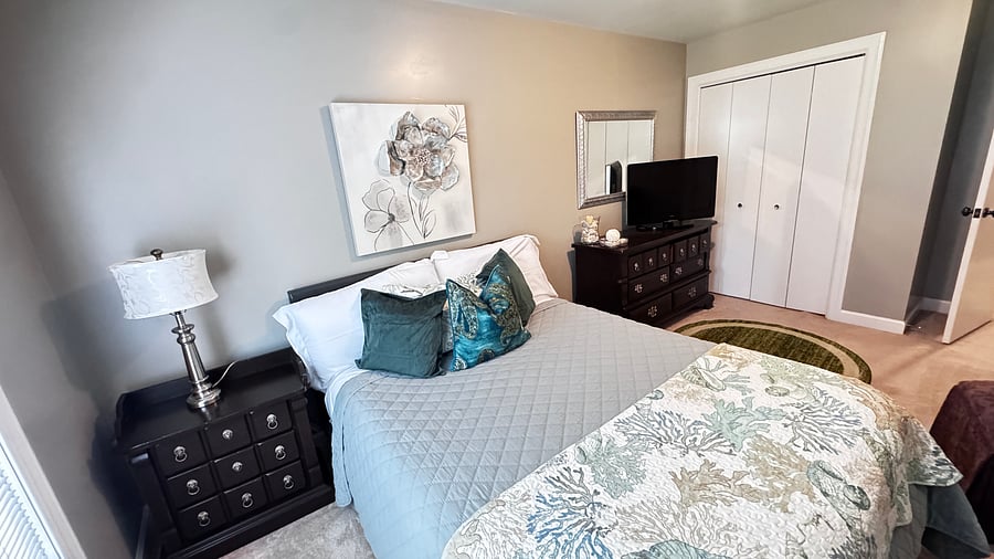 Second bedroom with a full bed and a TV
