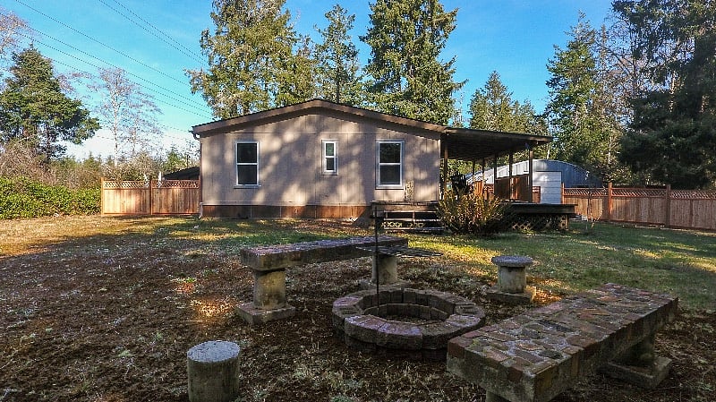 Fire pit area in the backyard. Yard care is included in the rent.