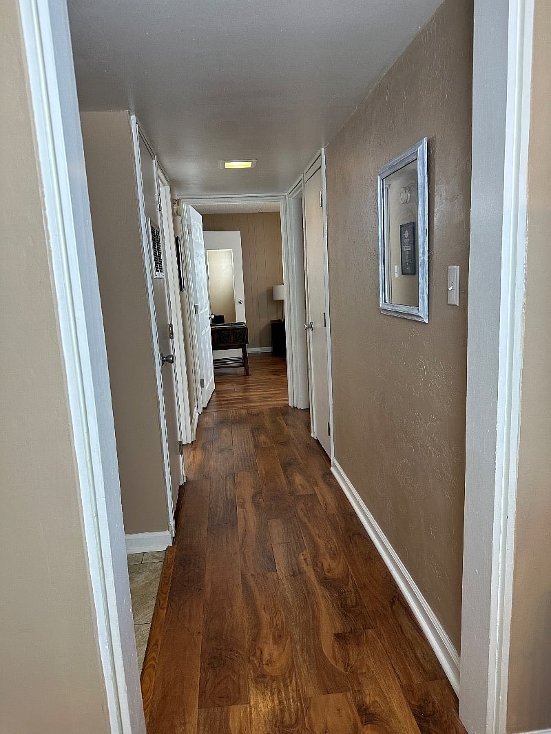 Walkway to both bedrooms in unit.