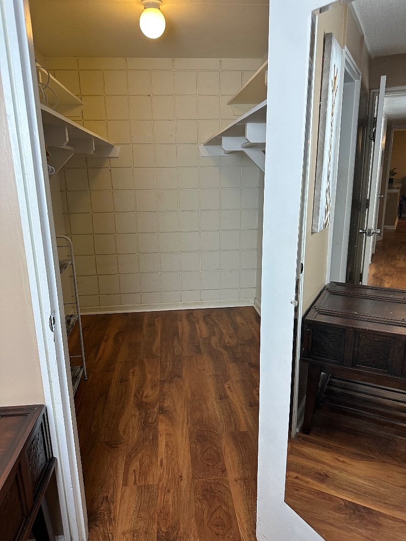 Walk in closet in the larger bedroom.