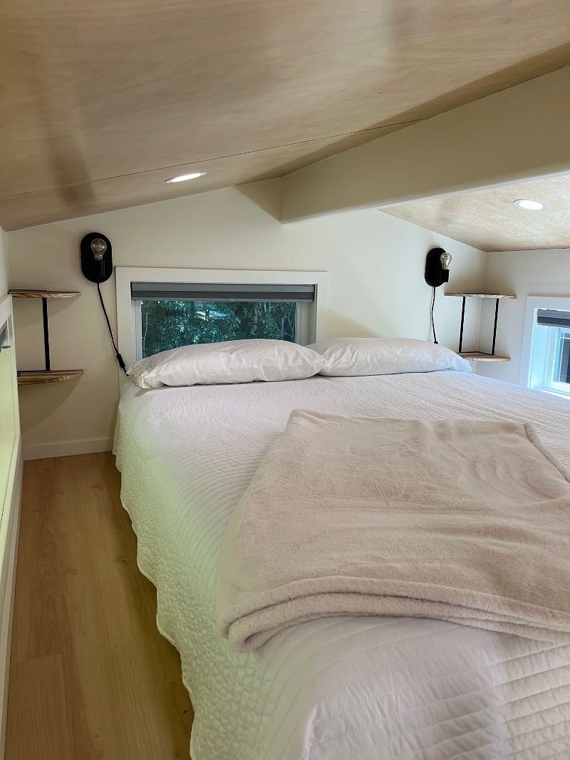 Queen-sized bed. Windows have black out shades.
