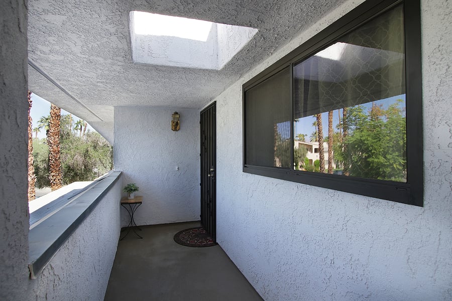 A flight of stairs leads to the entry door.