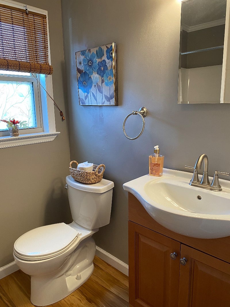 Private bathroom with ample shelving