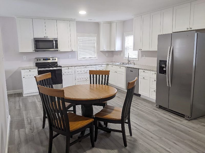 New appliances, furniture, cabinets and paint. We supply dishes and cutlery.