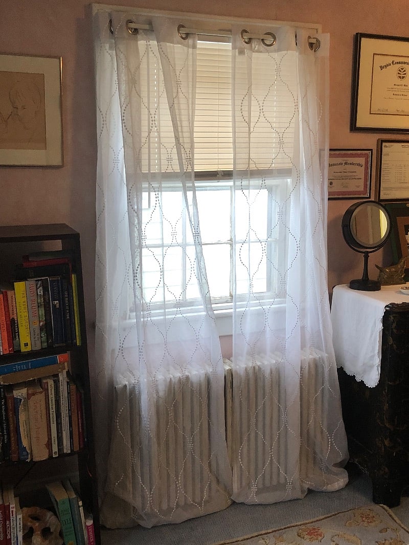2nd window in bedroom with blinds and curtains