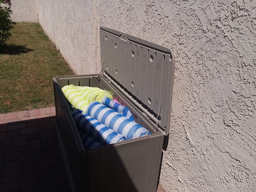 Deck box full of pool toys.