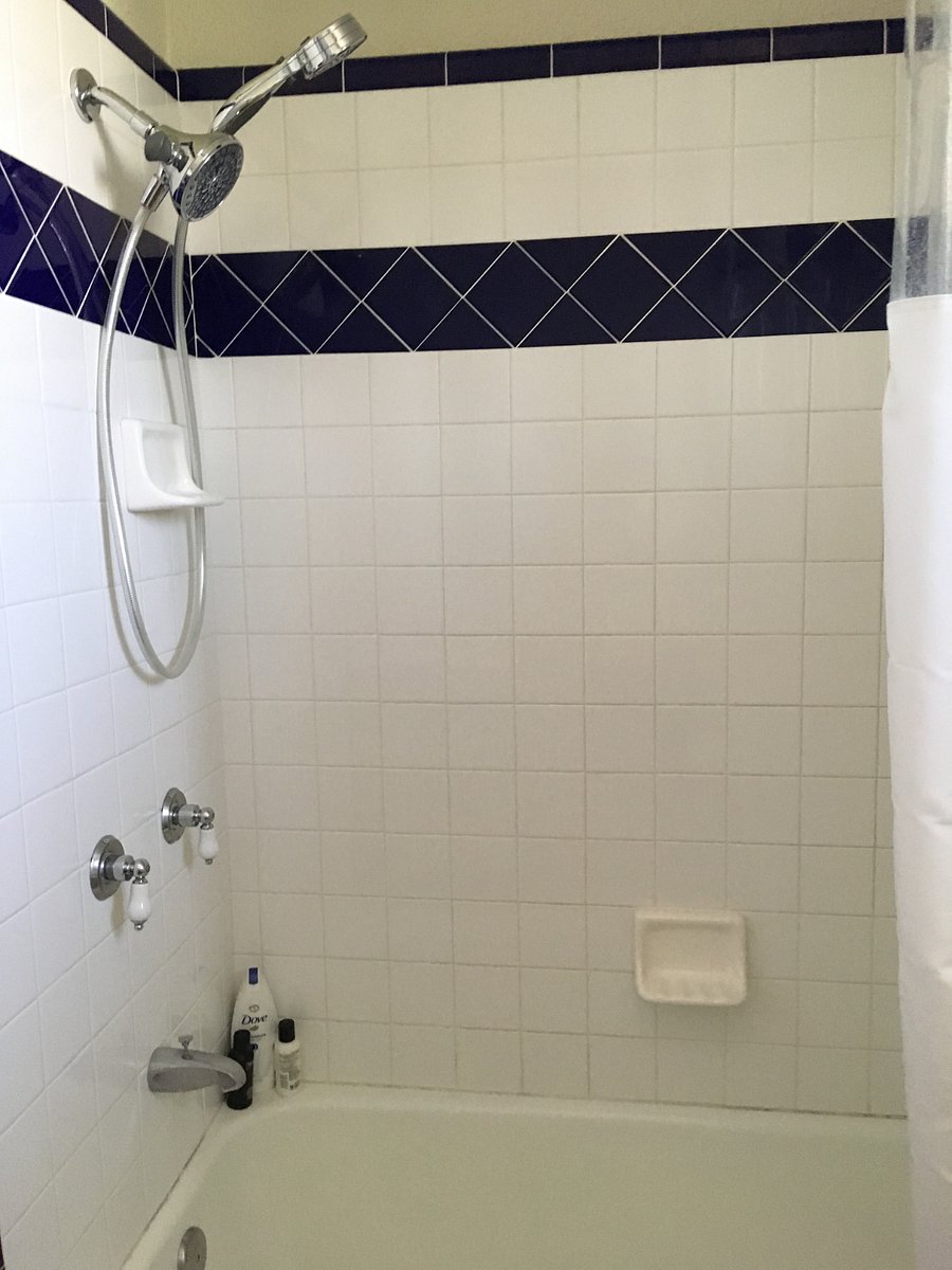 Tub/shower combination in larger bathroom.