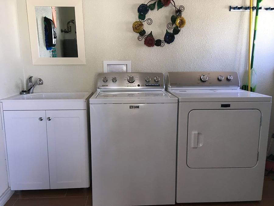 Laundry area near the pool and backyard.