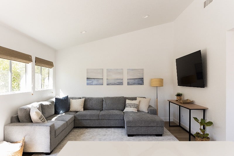 Comfortable sectional in the den.  Sectional pulls-out to be a sleeper.