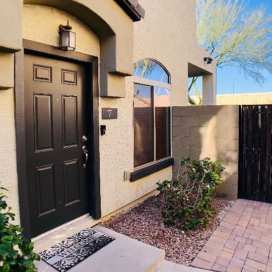 Private front entry with gate to patio