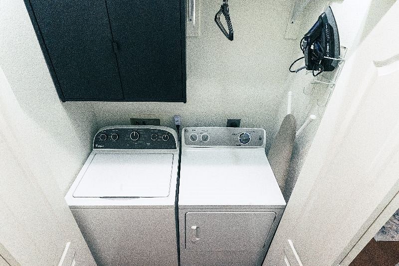Full size washer and dryer, iron, ironing board and steamer provided