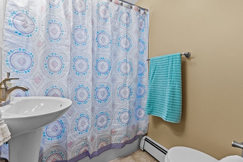 Recently updated full bath with tiled shower, tub and towels provided.