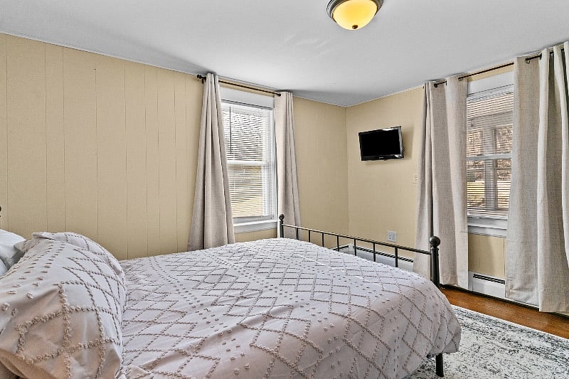 Bedroom 1- queen bed brand new mattress, linens provided, black out curtains, dresser, night stand and personal smart tv