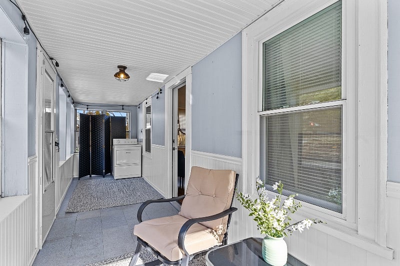 Dryer located on enclosed front porch- divider provided for extra privacy. Porch stays warmer in winter with bright sunshine!