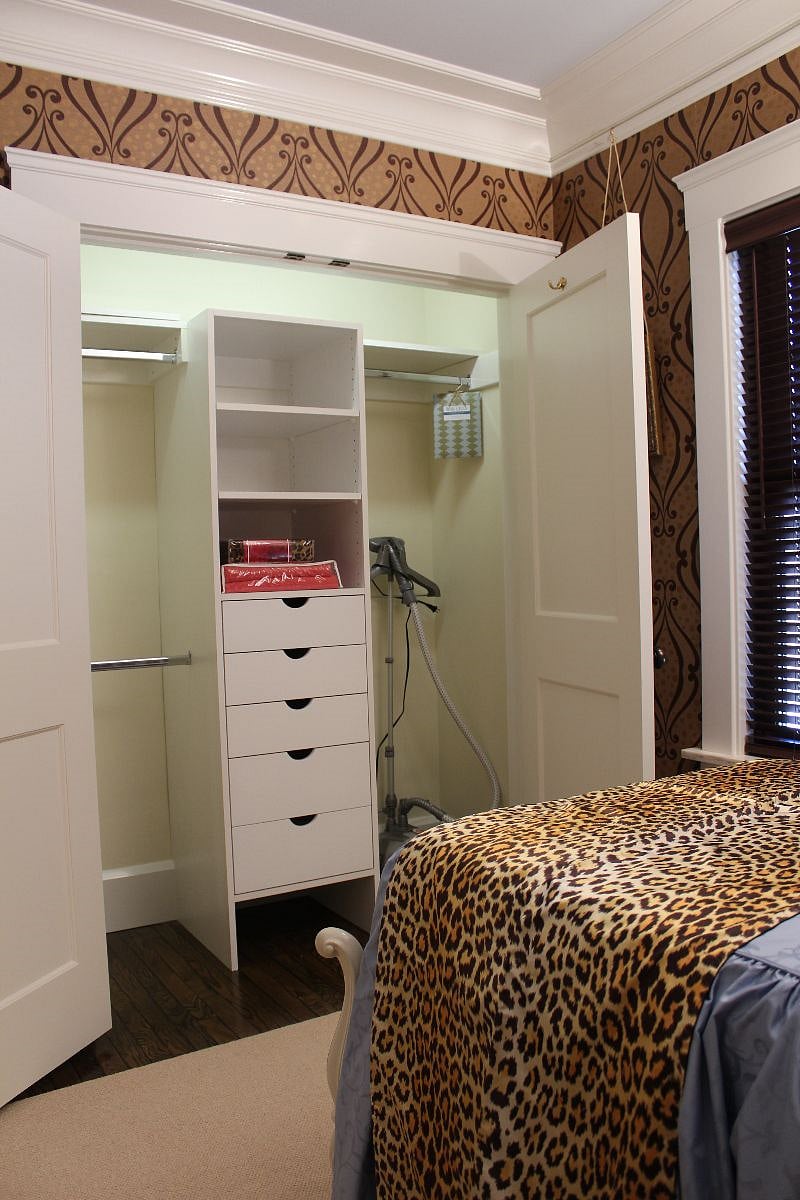 Front Bedroom - Large Closet with short and long hanging, shelves and full-extension drawers.