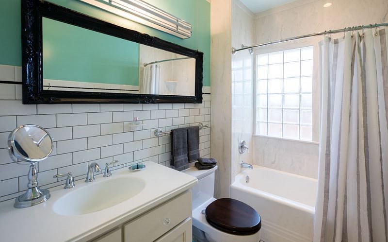 Bright light-filled Bathroom - 100 percent cotton towels, toilet paper, toiletries provided upon arrival for convenience, gleaming white subway tile, basketweave tile floor, porcelain tub with shower, Toto toilet, custom vanity with Corian counter and sink, large medicine cabinet, built-in Linen Closet, scale, hair dryer, magnifying mirror.