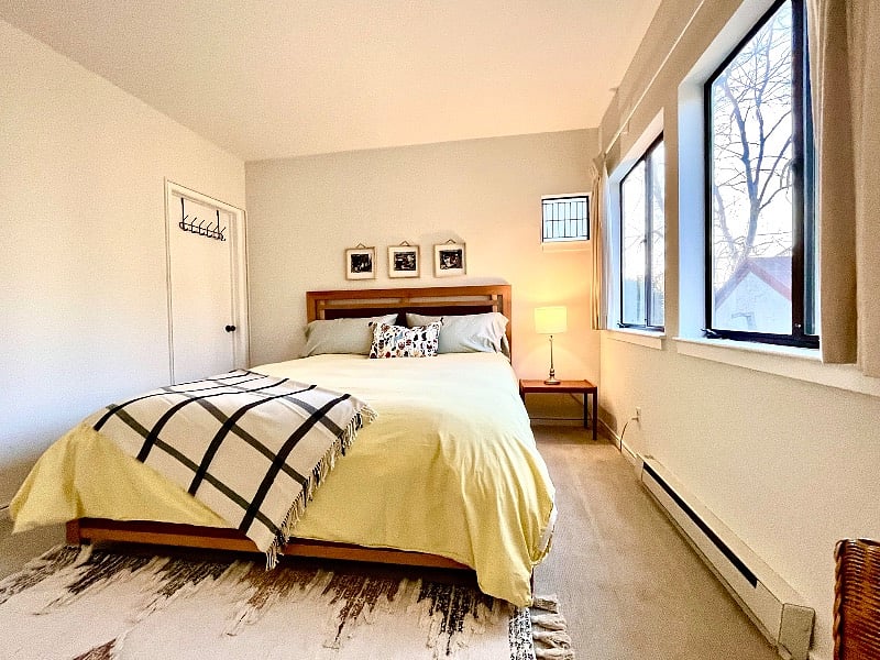 Primary bedroom with Cal King Bed, storage drawers in platform. Door leads to Jack N Jill bathroom