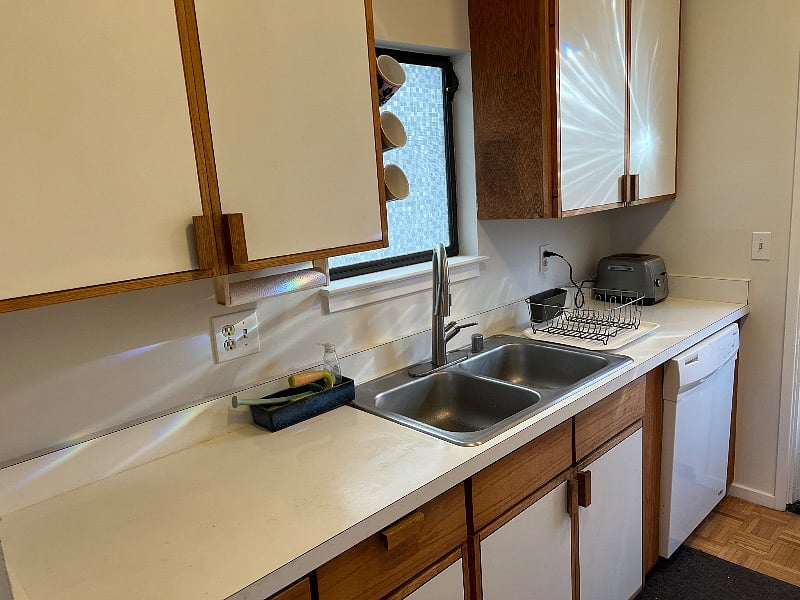 Kitchen galley, toaster, coffee maker, dishwasher, and garbage disposal