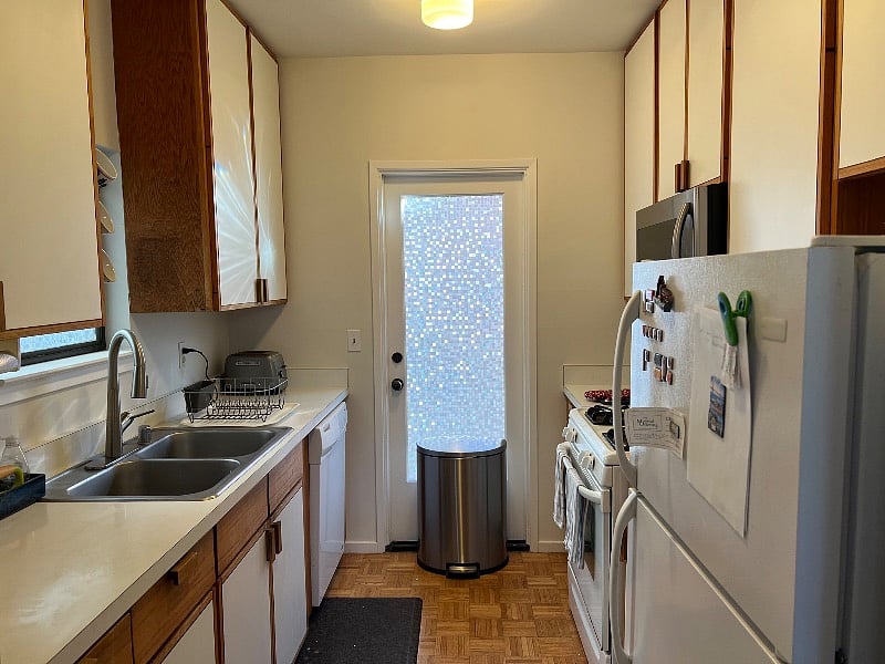 Kitchen galley, door leads to common patio area