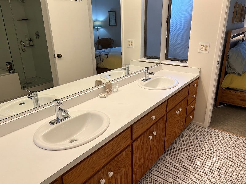Master bathroom Jack N Jill - connects to both bedrooms. Behind sinks are soaking tub, shower, and toilet