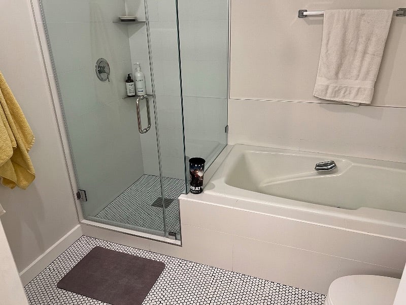 Deep soaking tub with adjacent shower stall