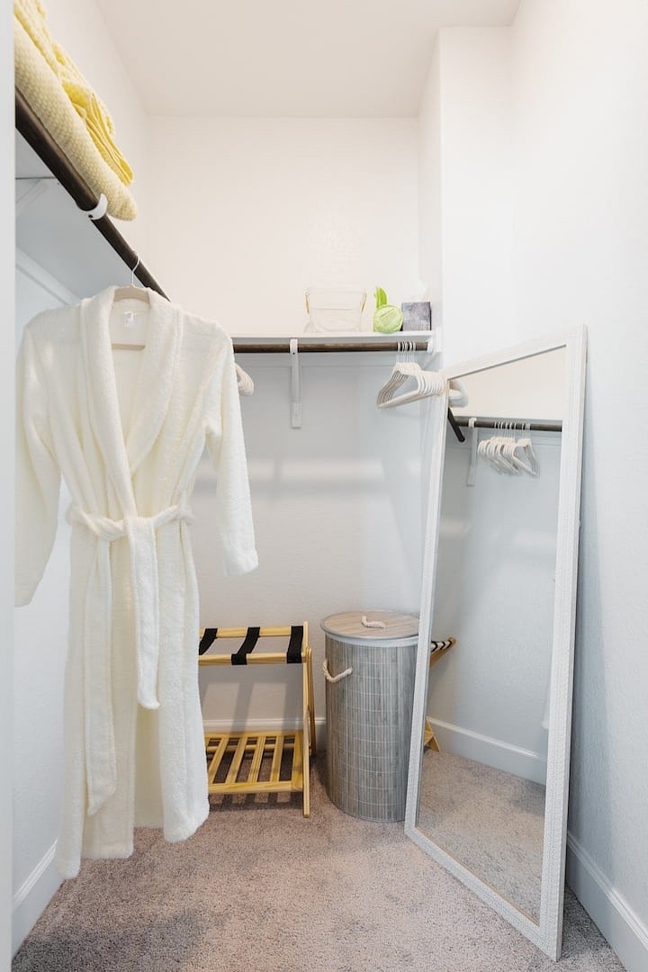 Large walk-in closet with mirror