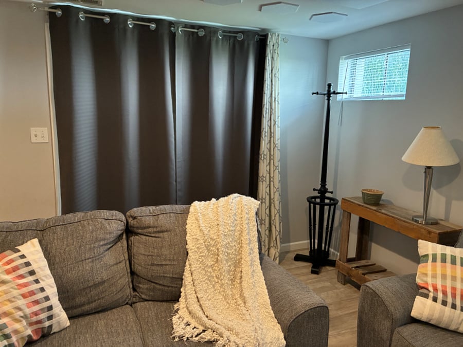 Two sets of curtains. This is room darkening for watching TV during the day or if you're a vampire.