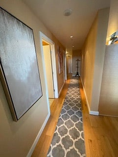 Entrance has two coat closets and in hall there is a storage and laundry room where HVAC is