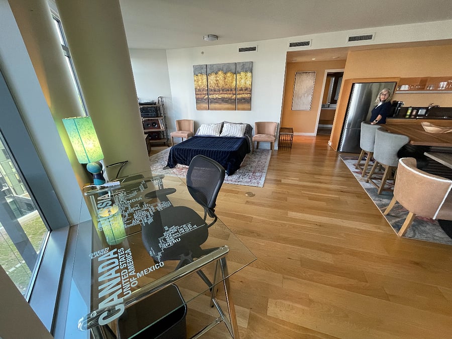 Comes with a Queen blow up matress if you have friends visit so you can move the dining table next to kitchen table and make a bed for your guests, or they can sleep on comfortable sectional. Also this shows the work desk with views to the river