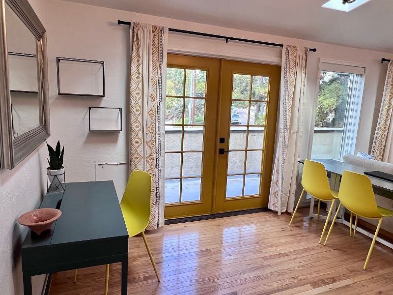 Two sets of french doors with a private balcony overlooking City Creek