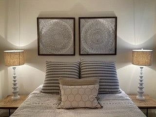 Upstairs bedroom has a queen bed and is professionally decorated and has a full bathroom