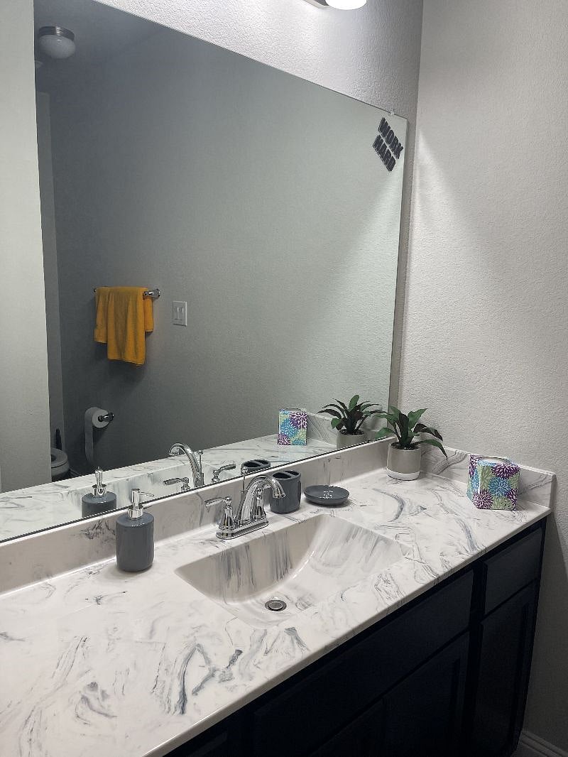 First bathroom with full shower/bath combo