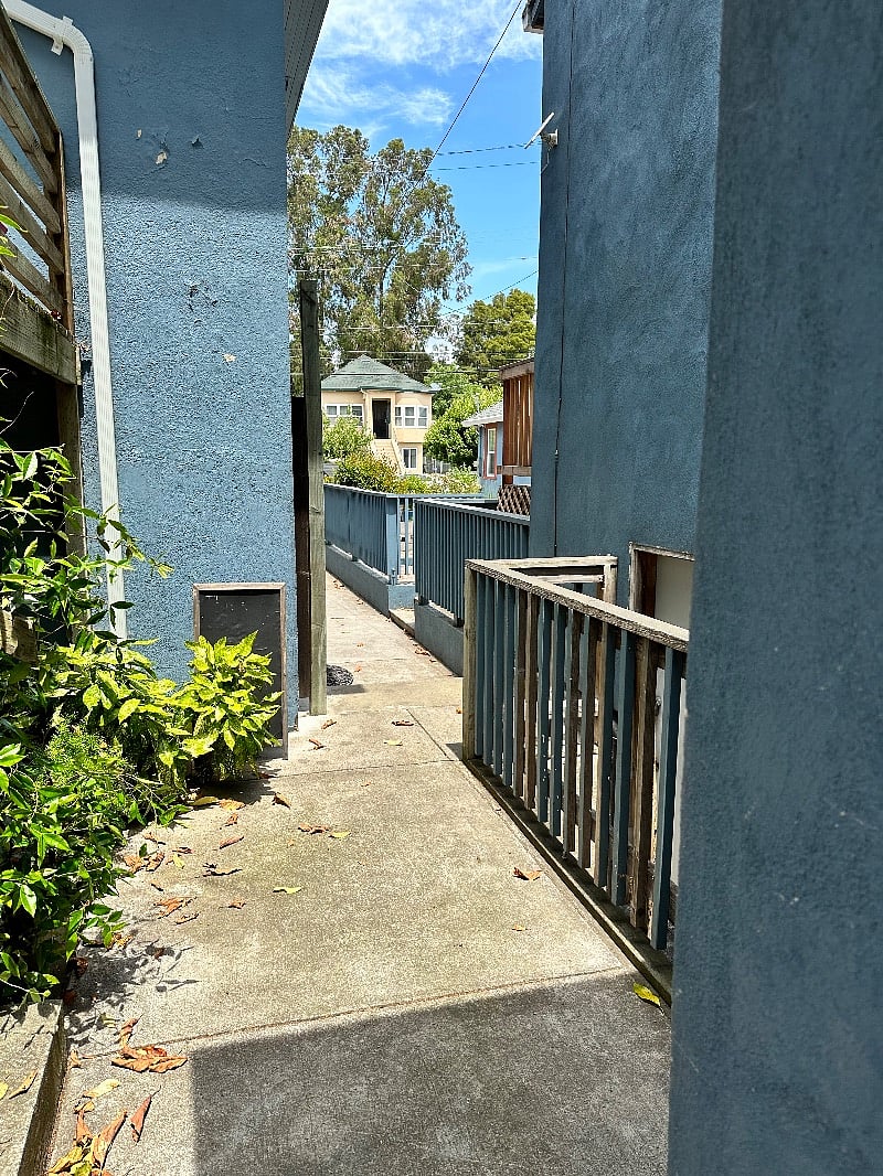 Pathway Leads to the back yard. and coin operated laundry. or just sit and enjoy.