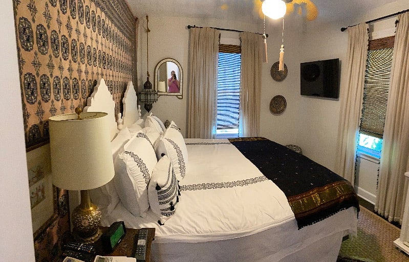 Master suite with king size bed, large TV, armoire and closet