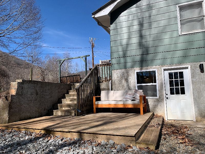 Private, south-facing deck. Your pups can access our 1/3 acre fenced in yard from the top of the stairs. We just finished building the fence, so it isn't pictured here.