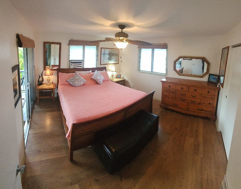 Master Bedroom (king) with AC and lanai access.